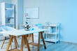 © Pixel-Shot - Scientific research and laboratory innovation, microscope with chemical glassware on desk in modern science classroom or pharmaceutical development lab
