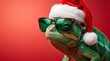 © Graphixa - Festive green chameleon wearing trendy dark sunglasses and fluffy red christmas santa hat against vibrant solid background highlighting unique holiday spirit and quirky humor