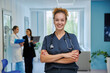 © Valerii Honcharuk - Smiling female doctor in scrubs with stethoscope in hospital portrait