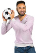 © fotofabrika - Man holds soccer ball in a playful manner indoors during daytime