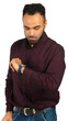 © fotofabrika - Man checking time on watch while standing indoors