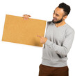 © fotofabrika - Man holds a blank corkboard and smiles while pointing at it indoors