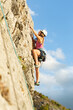© prelevicm - Girls climbing a rock face outdoors as part of women empowerment