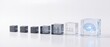 © Mulyono - Cubes arranged in ascending size depicting digital evolution from family to AI, business growth, technology advancement