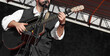 © Maxim Chuev - rock guitarist playing solo man singing at mic microphone acoustic electric modern black guitar pro male artist musician Stage scene no face Unrecognizable bearded adult person Mtskheta Georgia