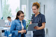 © Valerii Honcharuk - Young female nurse consulting mature patient with clipboard in medical clinic