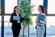 © Valerii Honcharuk - Teacher explaining lesson to student in modern office