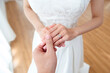 © tonefotografia - Asian Bride and Groom Holding Hands with Diamond Engagement Ring, Romantic Wedding and Marriage Commitment