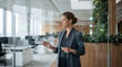 © ANIK - Businesswoman Analyzing Digital Flowchart Interface on Glass Board in Modern Corporate Office