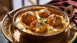 © Suresh Thangavel - Soft paneer kofta in creamy cashew gravy creates a luxurious vegetarian Indian restaurant composition.
