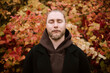 © ADDICTIVE STOCK - Young man meditate with closed eyes in autumn nature