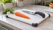 © Arslan - Adaptive cutting board and ergonomic knife with a whole carrot