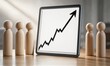 © joeycheung - Wooden figures face upward trend on tablet, symbolizing growth and teamwork in business.