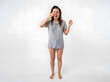 © nassar - Woman reacting to soap with hand near face on plain background