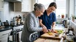 © rdkcho - Caregiver Assisting Senior Woman Cooking in Kitchen