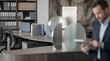© Wool World - Modern open plan office layout with ergonomic desks, privacy dividers, and organized storage shelving in a professional corporate workplace environment featuring a businessman with a tablet.