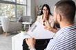 © Pixel-Shot - Job interview and recruitment process, candidate handing resume to recruiter in modern office for career opportunity and professional hiring success