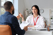 © Pixel-Shot - Job interview and recruitment process, human resources manager interviewing a candidate with a resume in a modern office