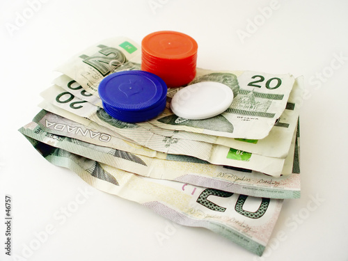 dollar bills and poker chips photo