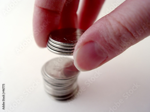 person stacking coins