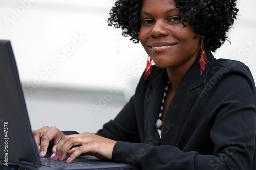 lady on computer smiles