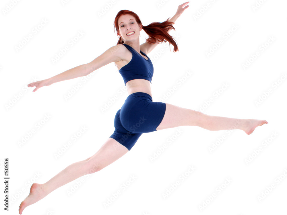 beautiful teenage girl in workout clothes leaping
