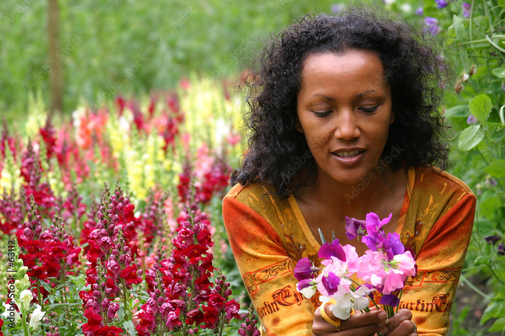 beautiful woman in flower garden beautiful woman in flower garden