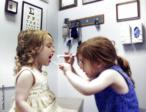 two little girls playing doctor