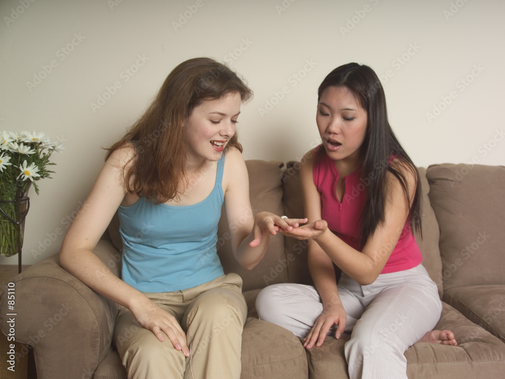 engaged girl shows her friend