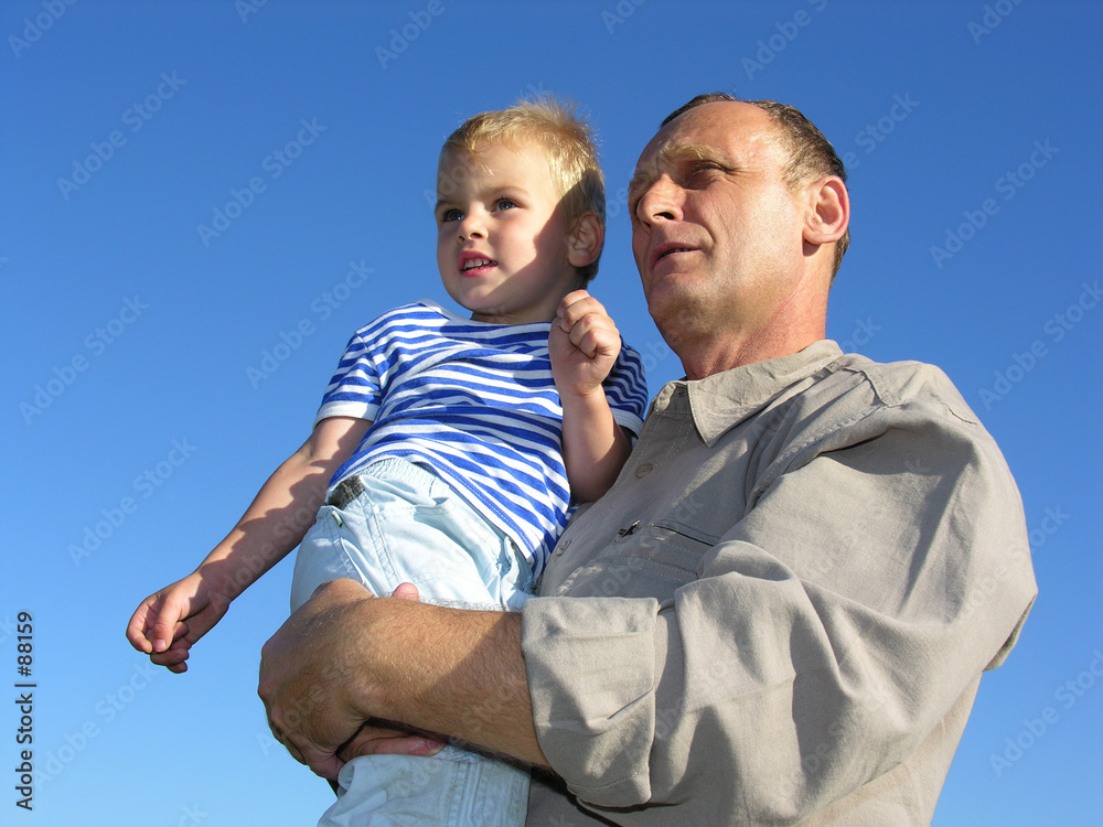 grandfather with grandson look at horizon and futu grandfather with grandson look at horizon and futu