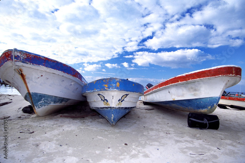 boats on beach and beautiful sky with clouds mexic
