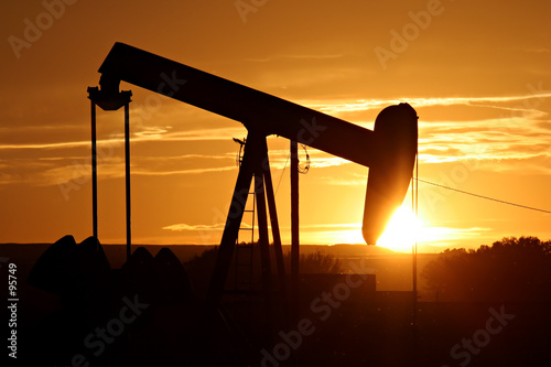 oil pump against setting sun photo