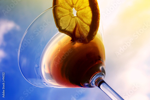 martini close-up, glass and lemon, detailed