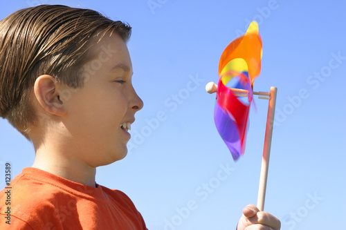 boy with a spinning wheel pinwheel photo