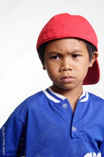 stock photo of mad kid in red cap