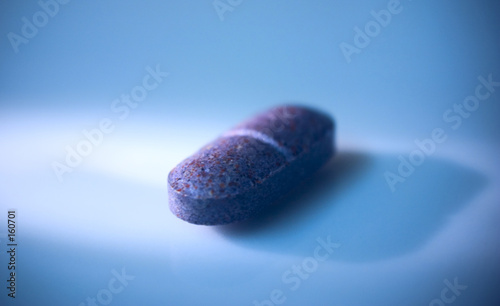 purple pill on blue
