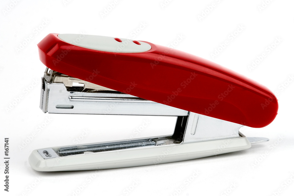 red stapler on the white background red stapler on the white background