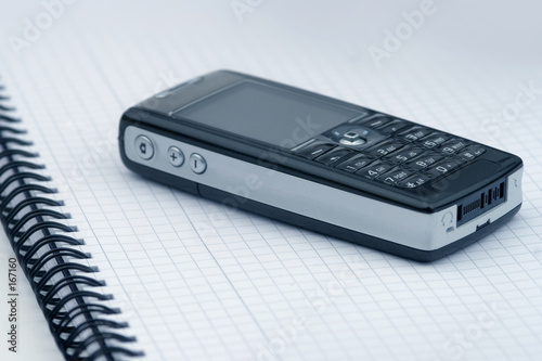 phone on the writing-book