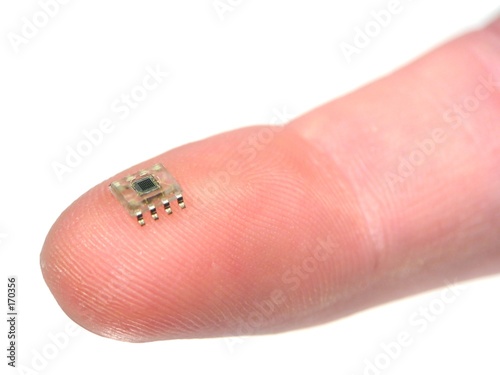 microchip on a fingertip photo