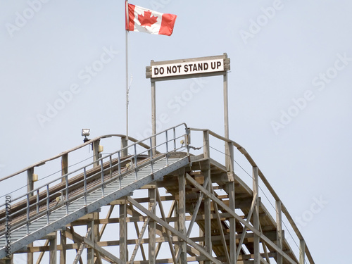do not stand up warning on top of roller coaster