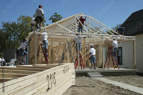 workers framing a house