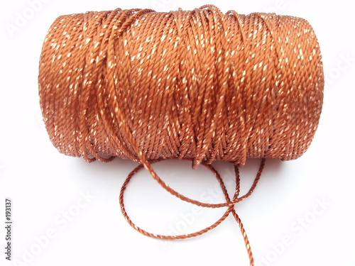 Konstfotografi cone with orange and golden thread
