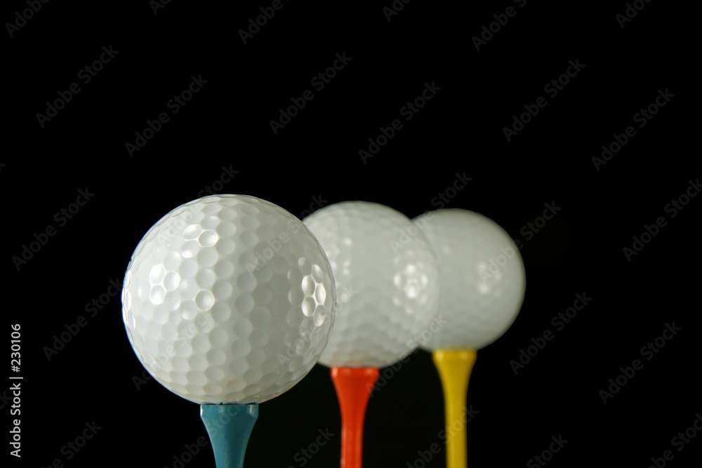 three golf balls in a row