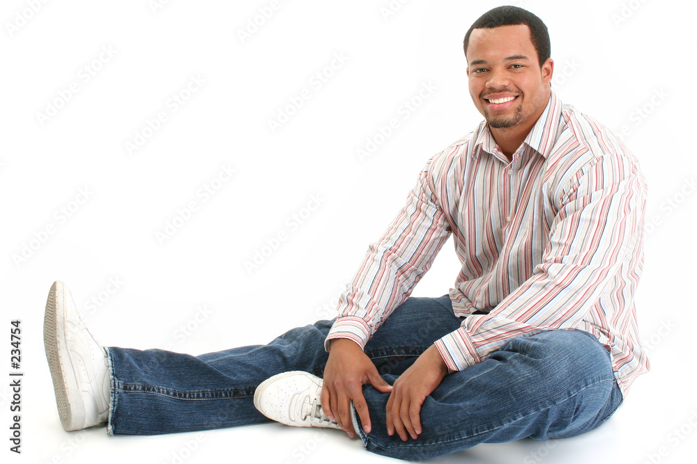 handsome male sitting on floor handsome male sitting on floor