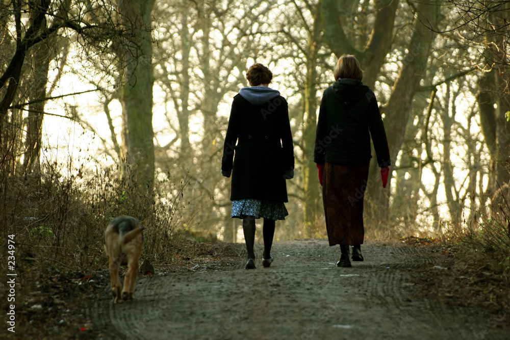 women walking dog