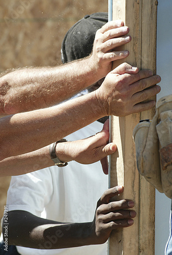 hands supporting a wall