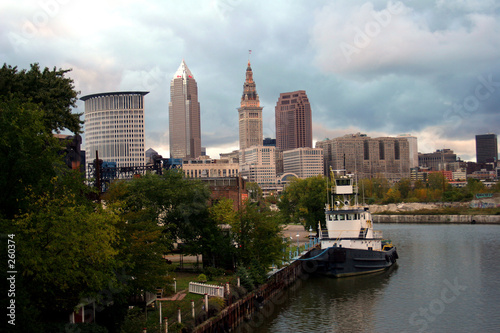 skyline of cleveland, ohio with boat on the cuyaho
