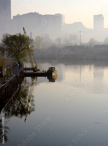 boat on a river with cleveland skyline