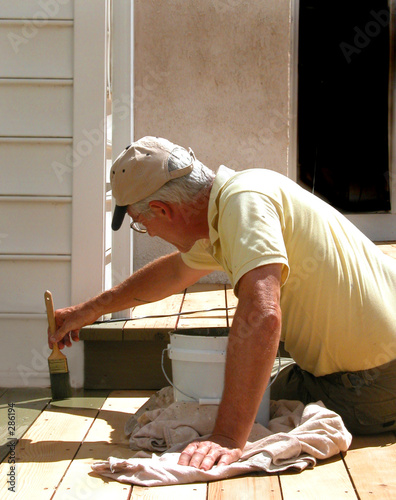 man staining a deck 1