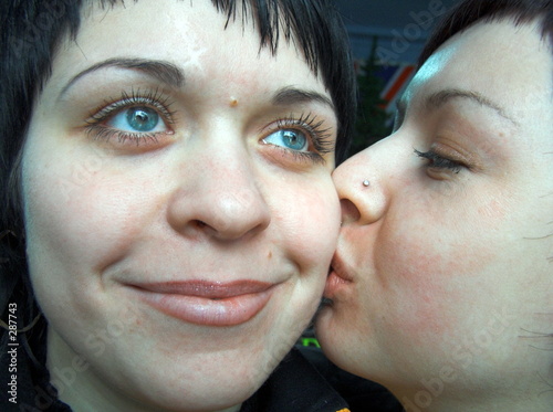 the girl kisses the girlfriend.